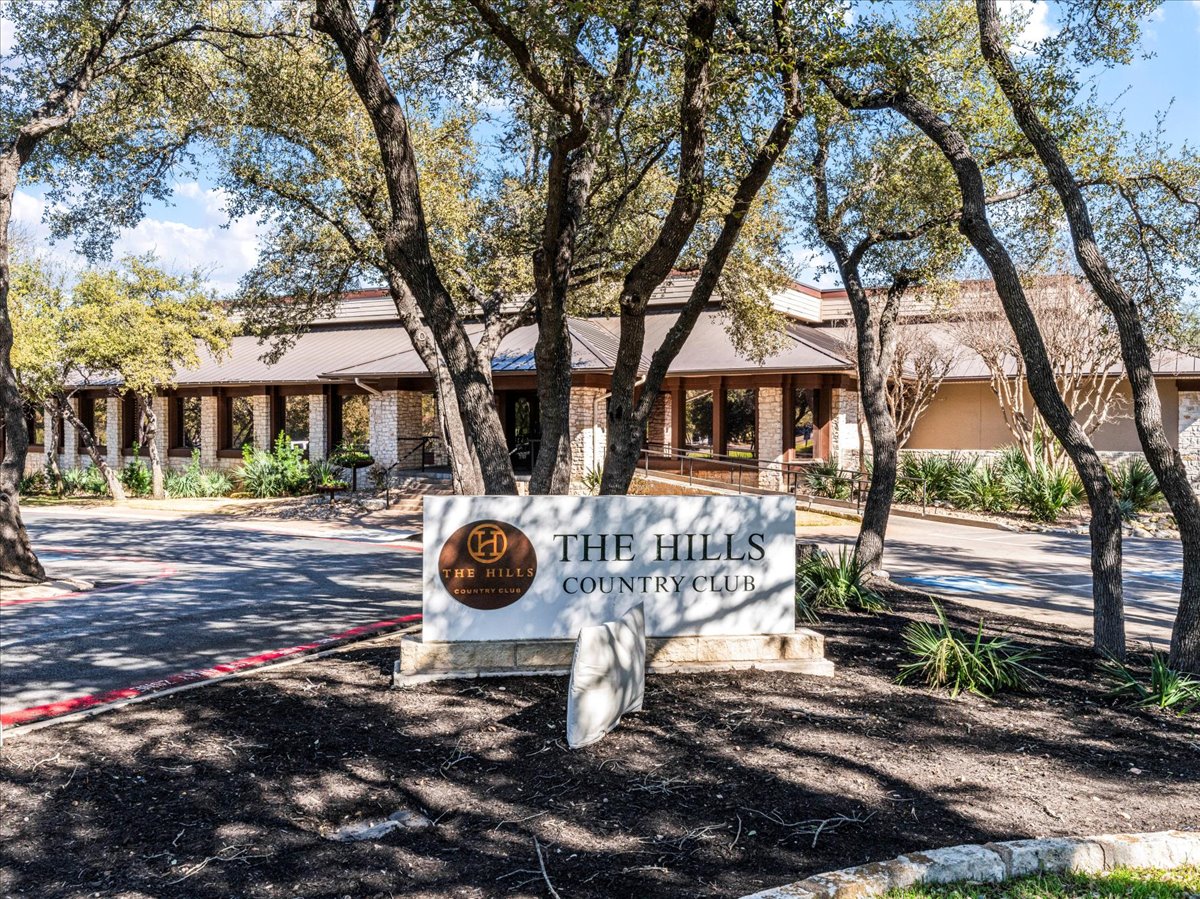 58 Cottondale Road The Hills, TX 78738 - Photo 37 of 40 a front view of a house with garden and trees