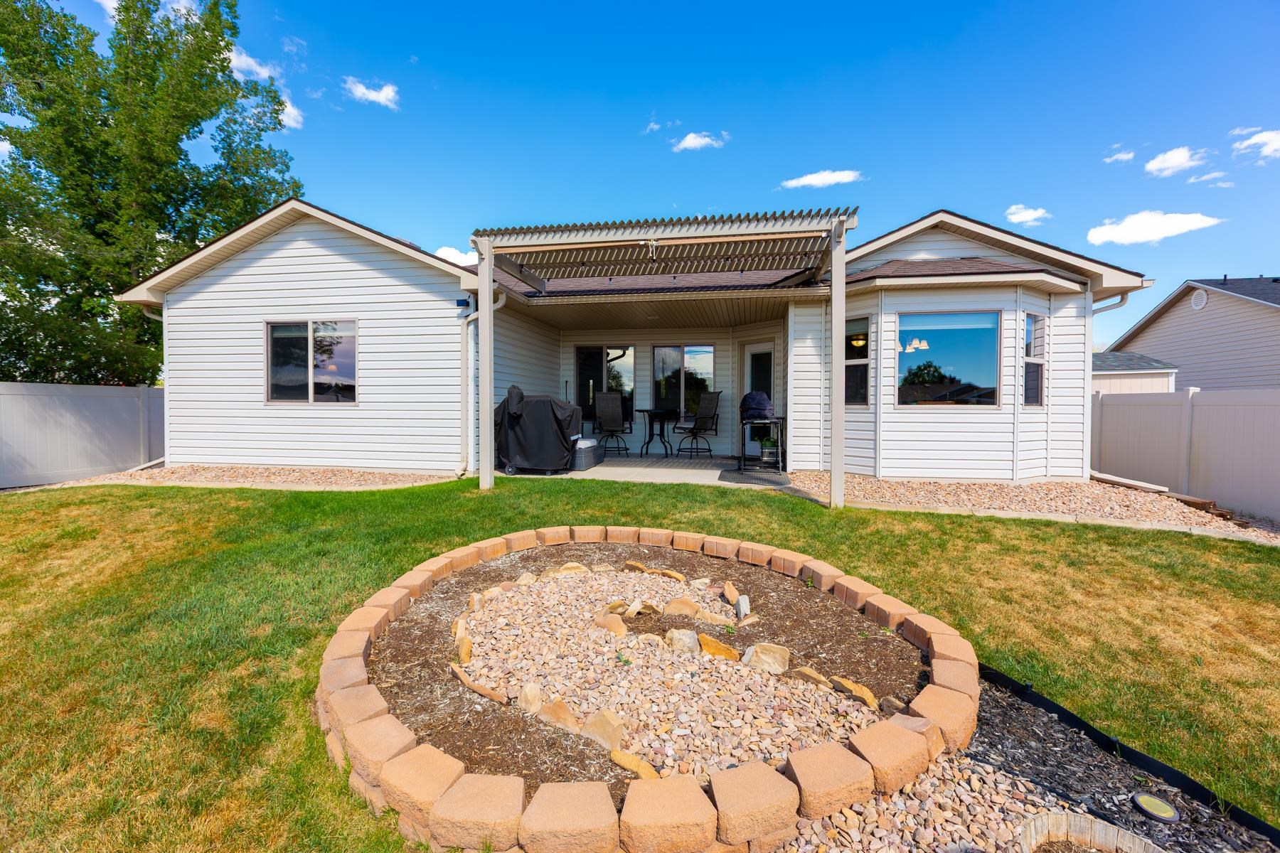103 Red Rocks Street Fruita, CO 81521 - Photo 11 of 39 front view of house with a yard