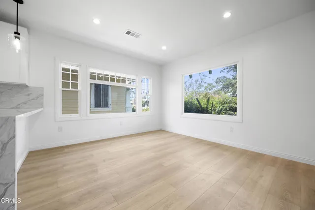 a view of an empty room with a window