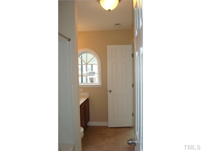 3010 Berkeley Street, Unit 33 Raleigh, NC 27612 - Photo 10 of 12 Jack and Jill bath connects the second bedroom to the flex room!