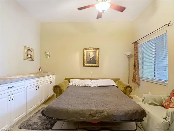 a bedroom with a bed and a table