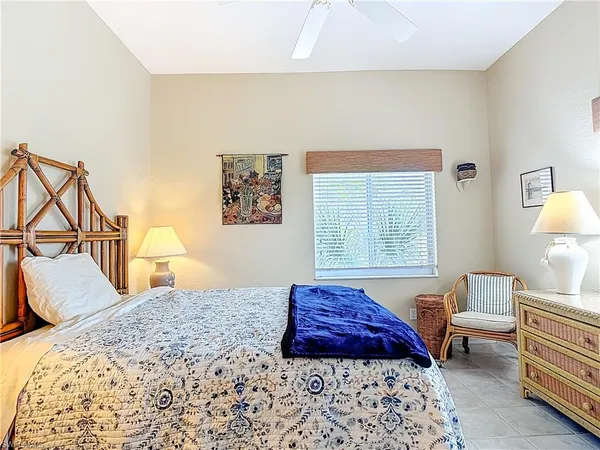 a bedroom with bed and a window
