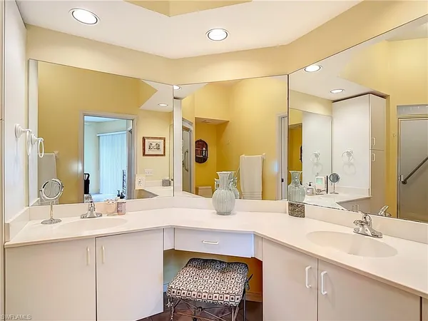 a bathroom with a double vanity sink mirror and double