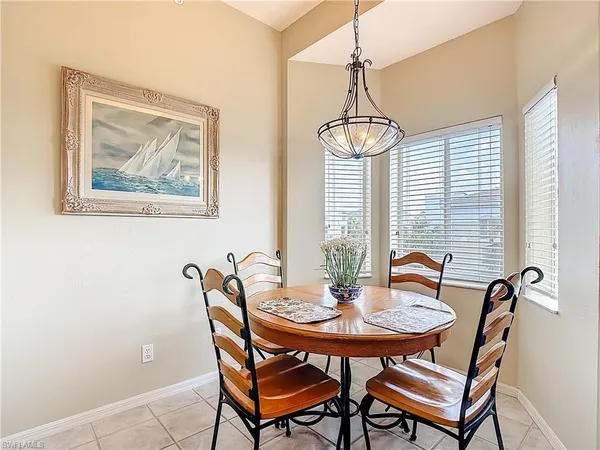 a dining room with furniture and window