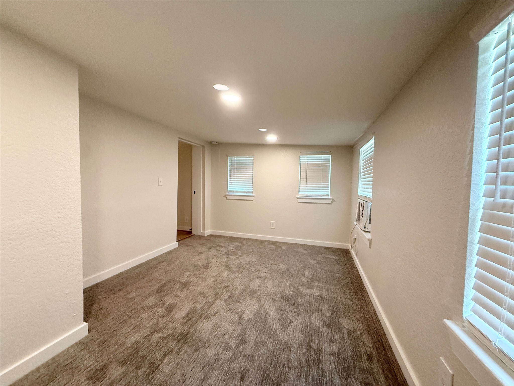 738 Caisson Street Surfside Beach, TX 77541 - Photo 14 of 19 a view of an empty room and a window