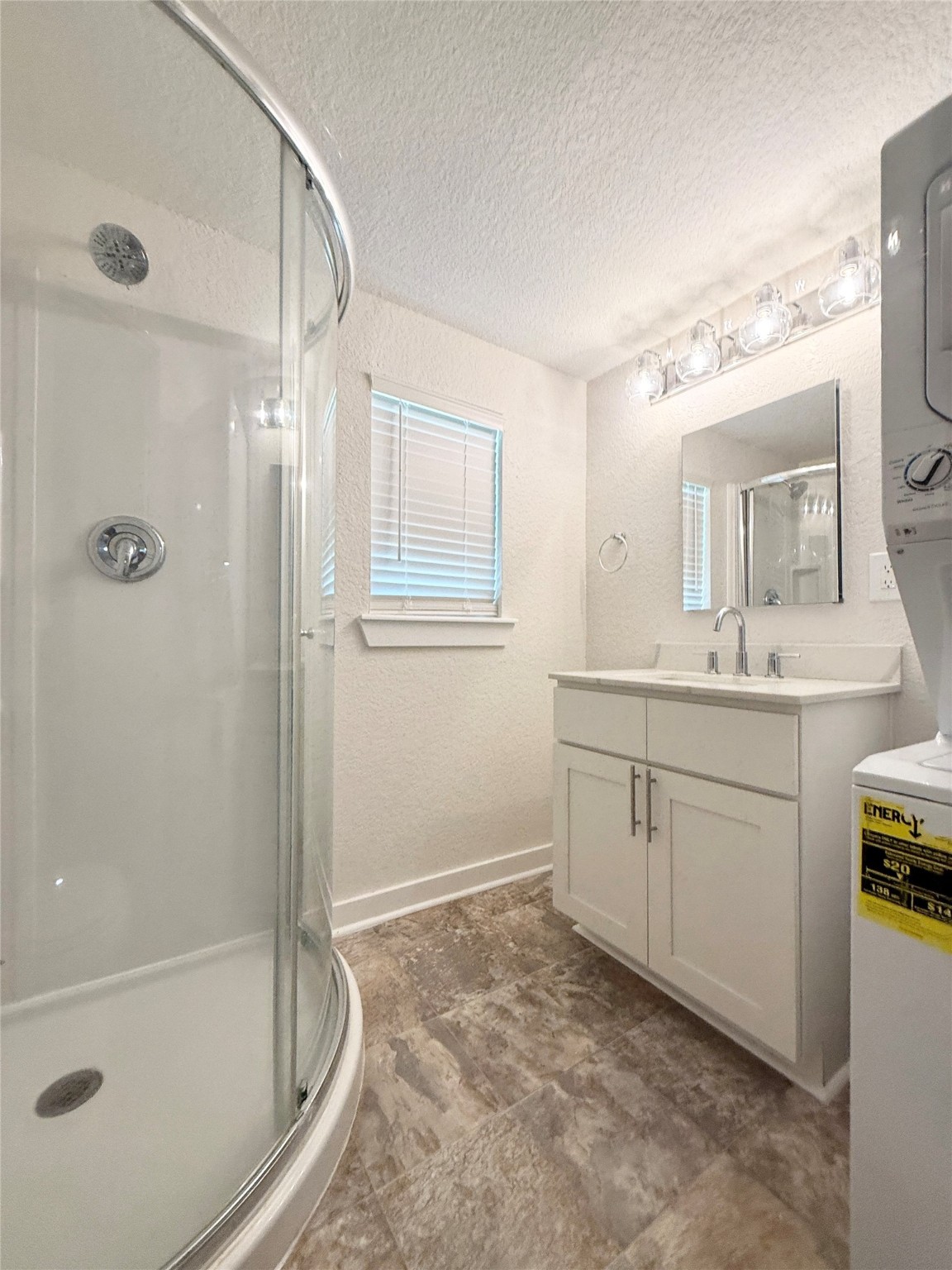738 Caisson Street Surfside Beach, TX 77541 - Photo 15 of 19 a spacious bathroom with a granite countertop sink a toilet and shower
