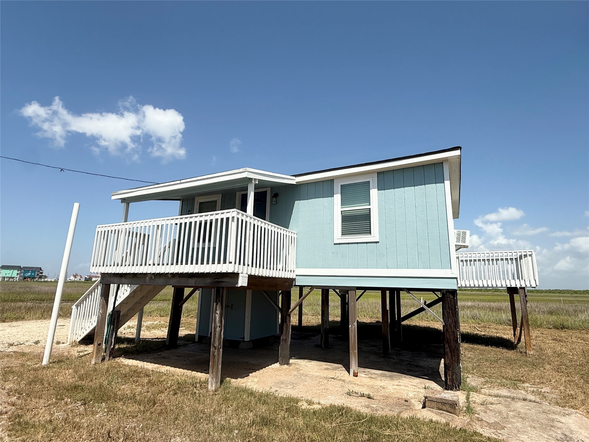 738 Caisson Street Surfside Beach, TX 77541 - Photo 3 of 19 a bedroom with furniture and a window