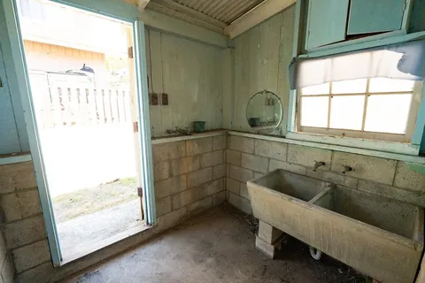 a bathroom with a bathtub and shower