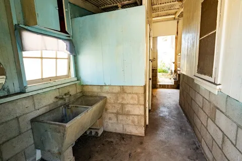 a bathroom with sink and window