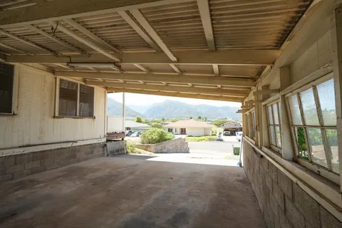 a view of a porch with seating space