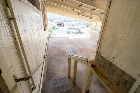 a view of a door with wooden floor