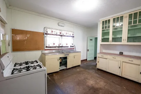 a kitchen with a stove and a sink