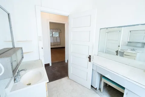 a bathroom with a sink and mirror