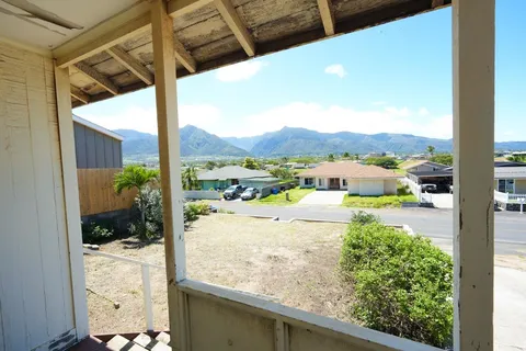 a view of balcony with a yard