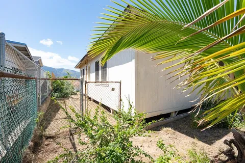 a view of backyard with a garden and deck area