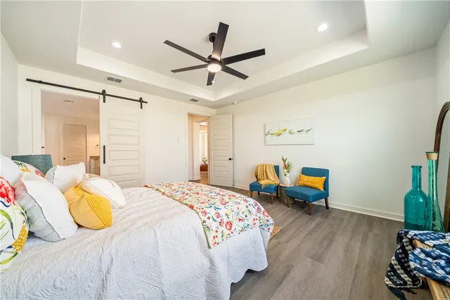 a large white kitchen with a white countertops a stove and a bathtub