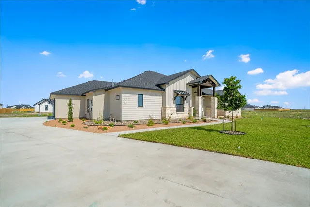 a living room with fireplace furniture and a wooden floor