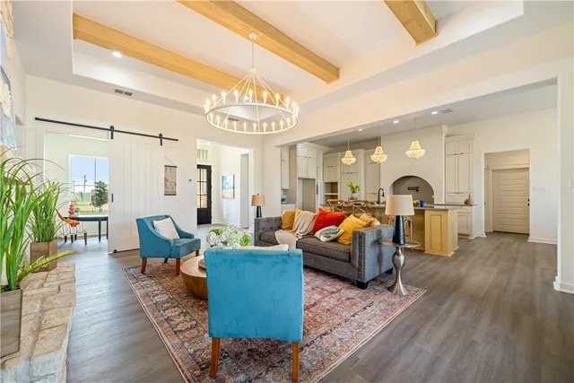 a kitchen with a sink a counter top space and stainless steel appliances