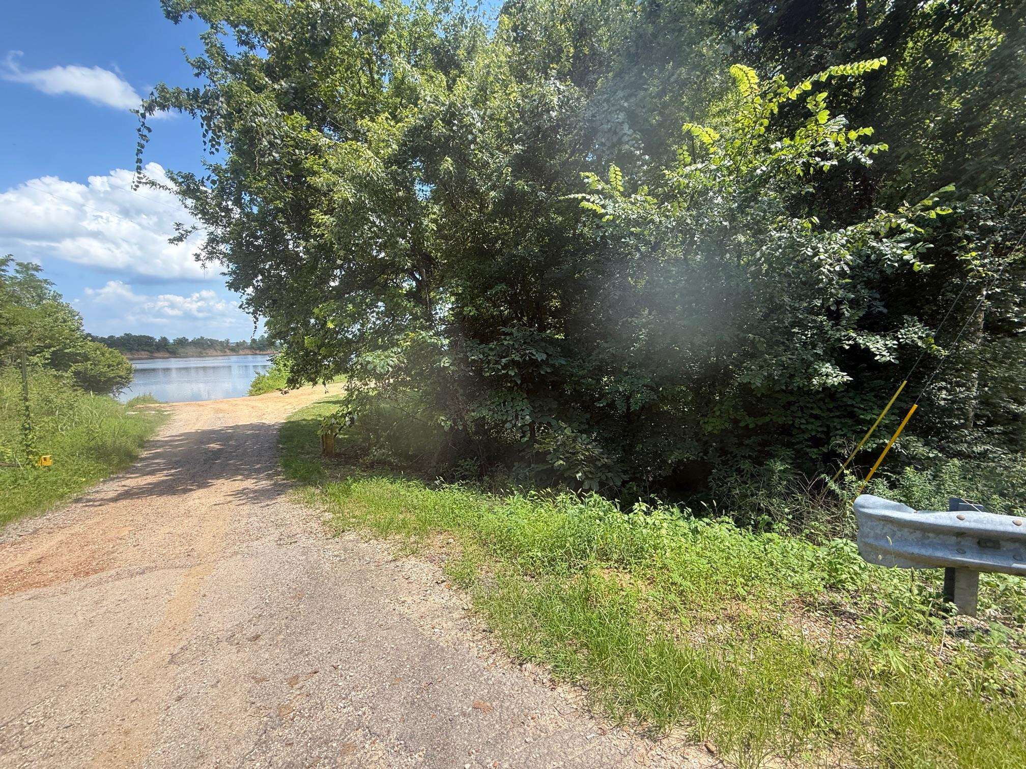4 Coffee Landing Road Adamsville, TN 38310 - Photo 14 of 16 View of road featuring a water view