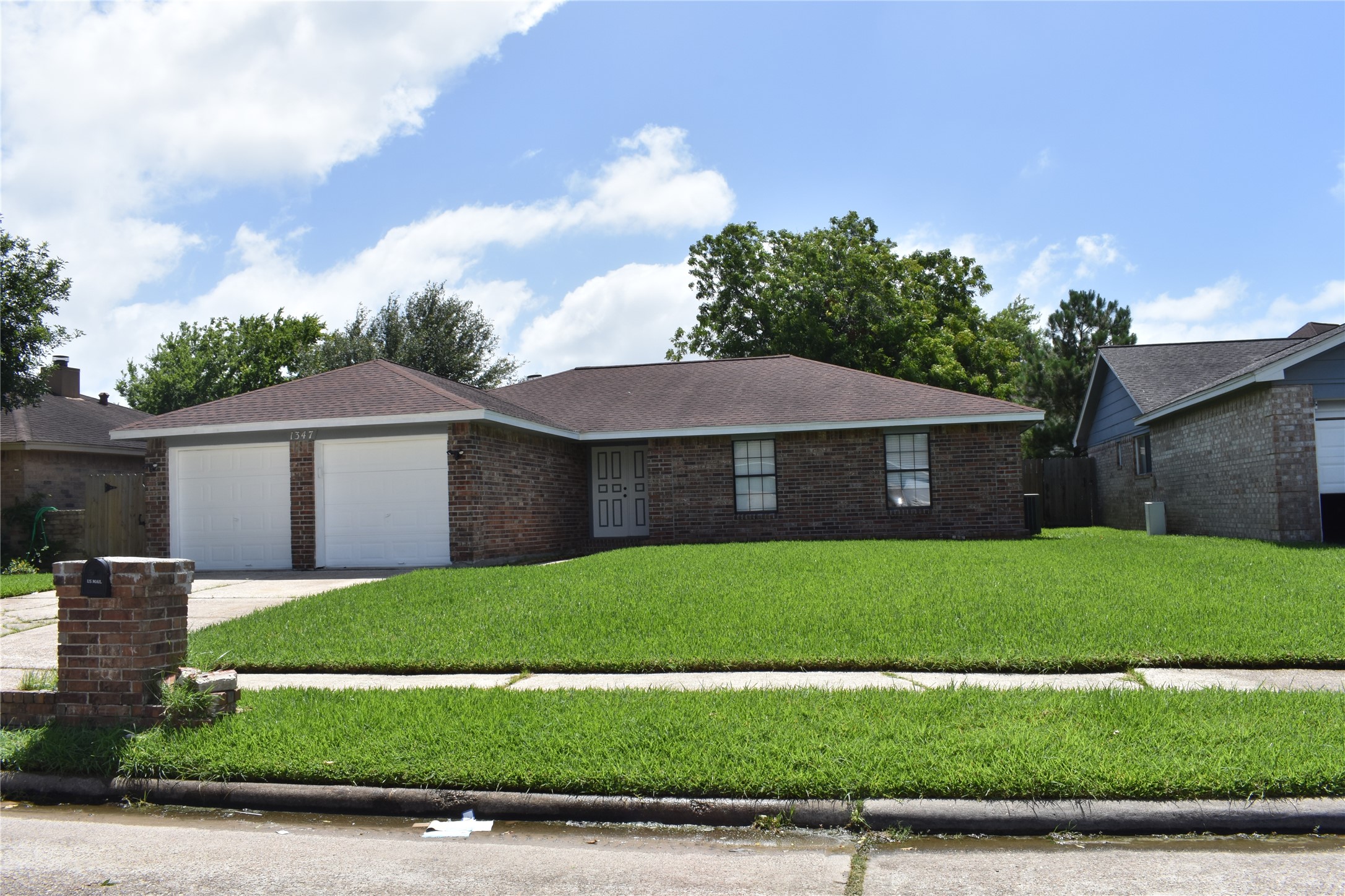 1347 Somercotes Lane Channelview, TX 77530 - Photo 3 of 30 a view of a yard in front of a house with a garden