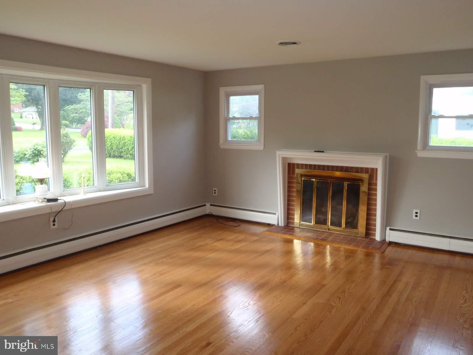 760 Gist Road Westminster, MD 21157 - Photo 3 of 28 Living room with Hardwood floors and Gas Fireplace