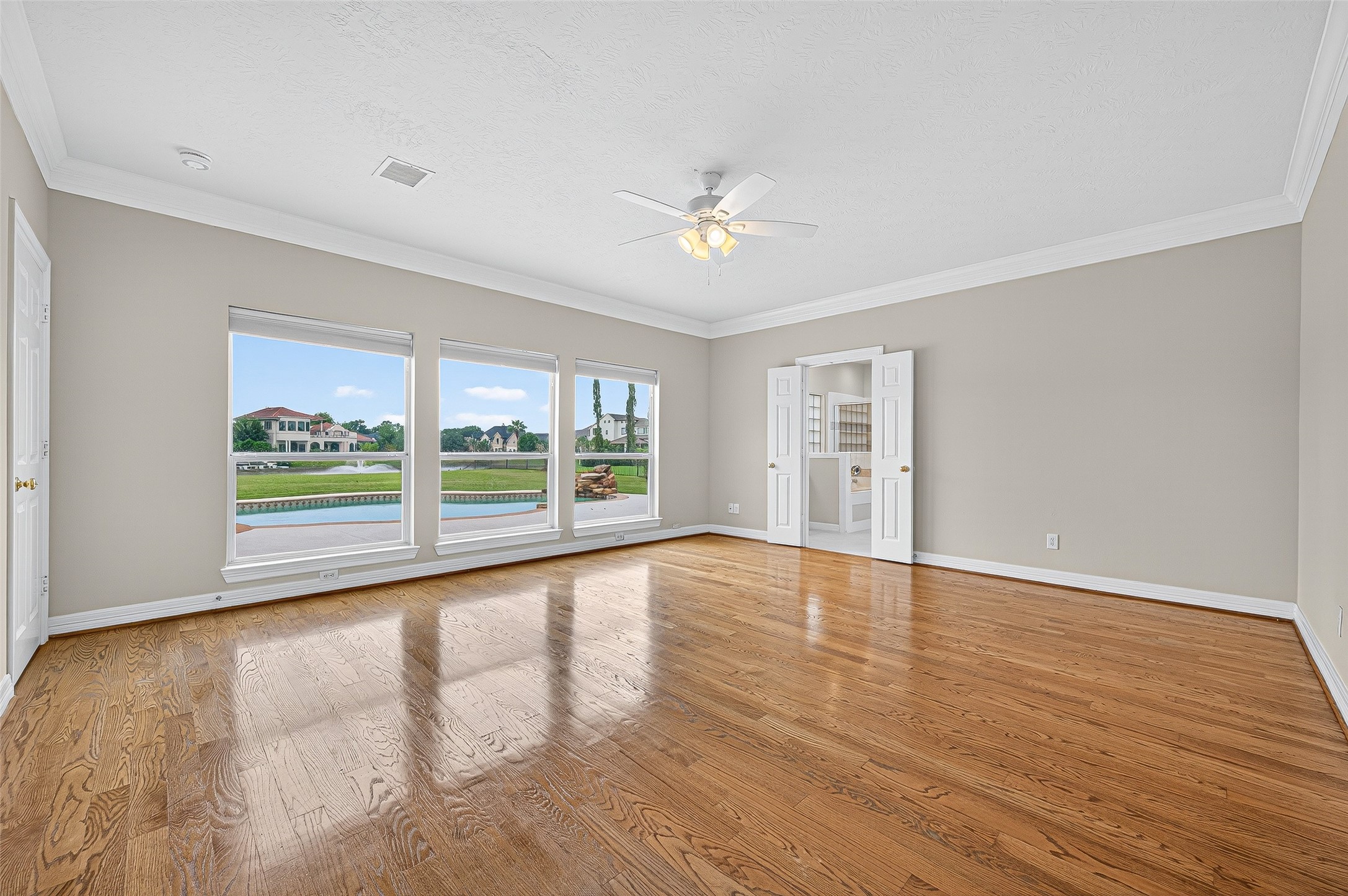 1902 Sparrows Ridge Katy, TX 77450 - Photo 14 of 48 a view of an empty room with a window and wooden floor
