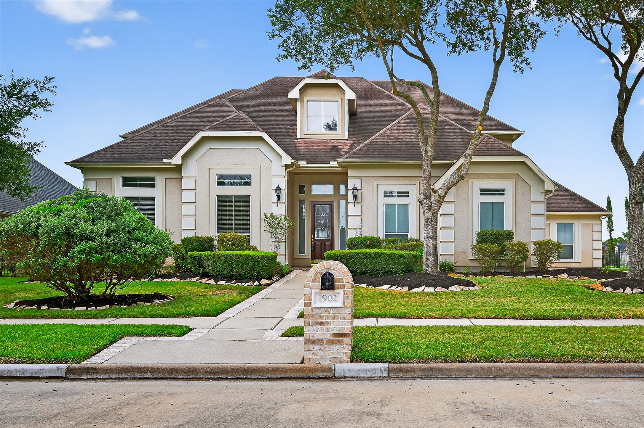 1902 Sparrows Ridge Katy, TX 77450 - Photo 3 of 48 a front view of a house with a yard