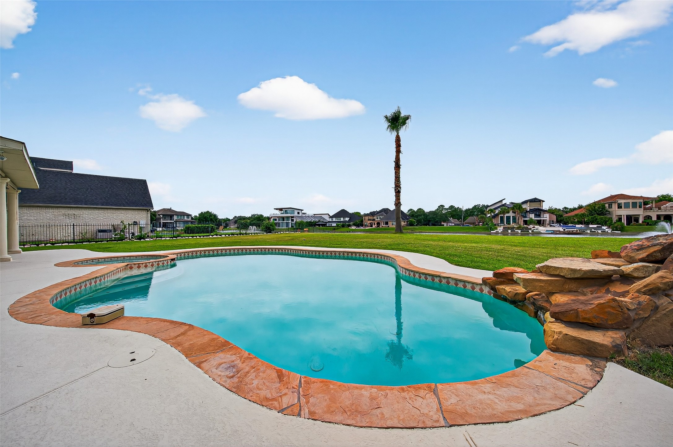 1902 Sparrows Ridge Katy, TX 77450 - Photo 35 of 48 a view of a swimming pool with a table and chairs