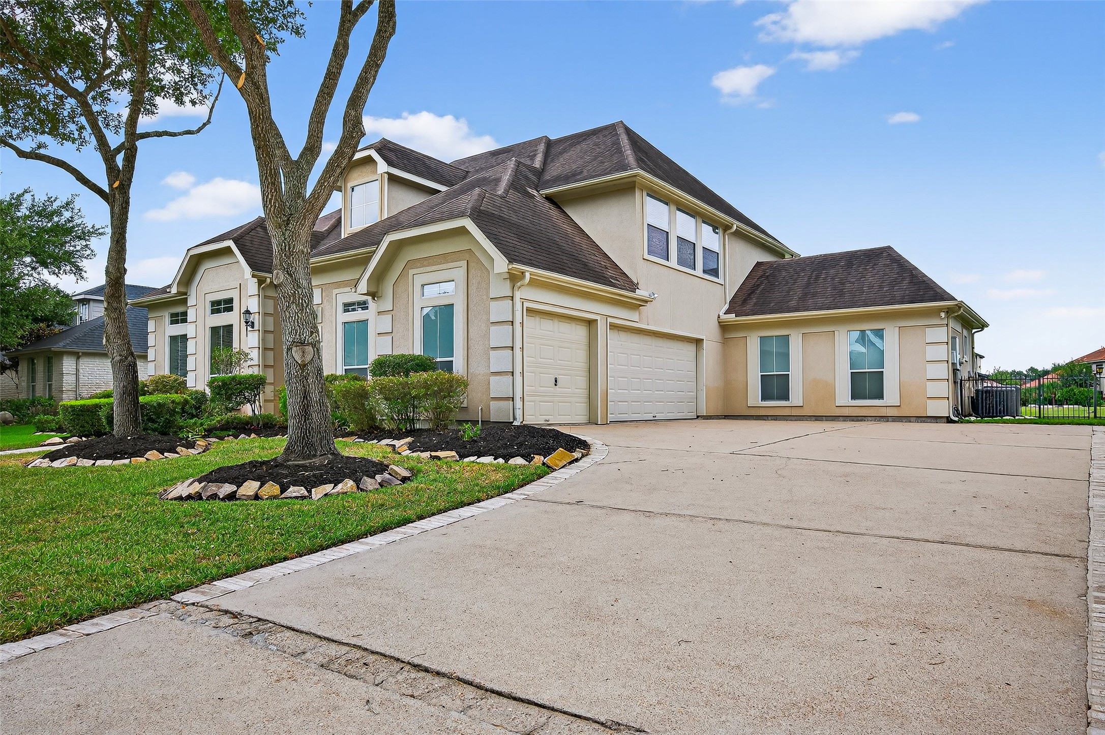 1902 Sparrows Ridge Katy, TX 77450 - Photo 38 of 48 a front view of a house with a yard and garage