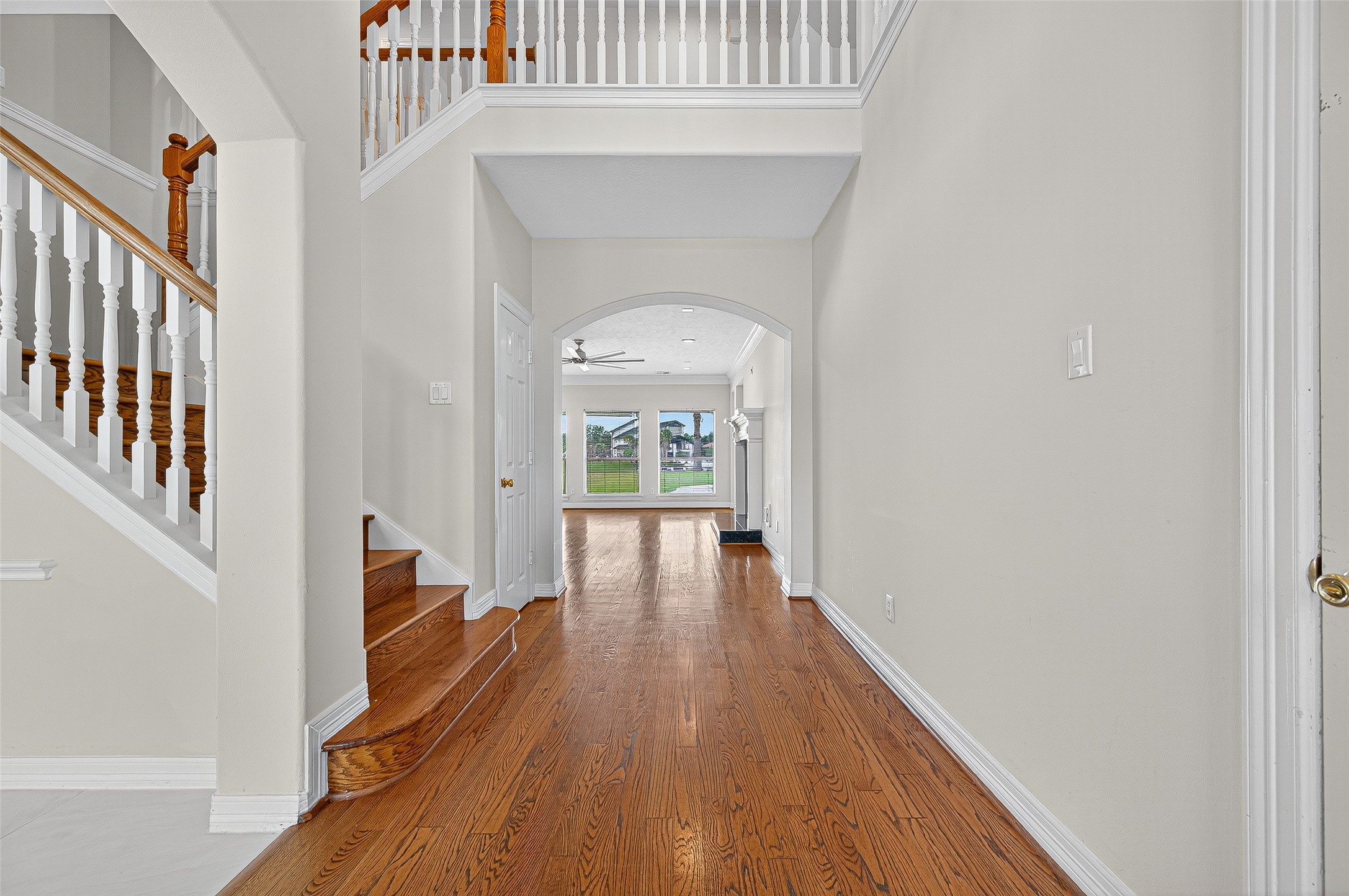 1902 Sparrows Ridge Katy, TX 77450 - Photo 4 of 48 a hallway with wooden floor windows and entryway