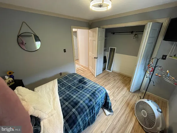 a white toilet sitting next to a bathroom sink and a shower