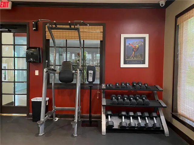 a room with furniture and gym equipment
