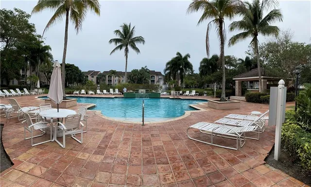 a view of a backyard with sitting area