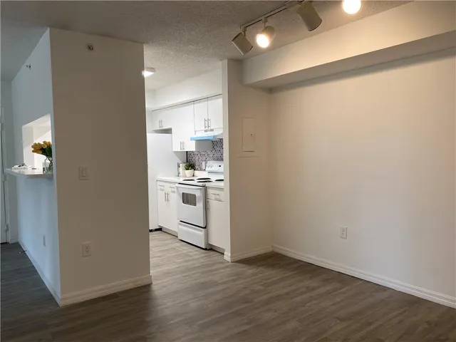 a view of kitchen with wooden floor