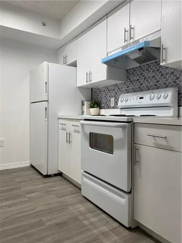a kitchen with appliances and cabinets