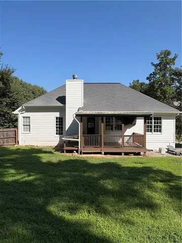 a view of a house with a big yard