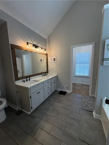 a room with window and flat screen tv