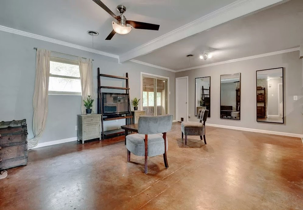 3209 Barton View Drive, Unit A Austin, TX 78735 - Photo 3 of 14 Living area with healthy amount of natural light, concrete flooring, ornamental molding, and ceiling fan