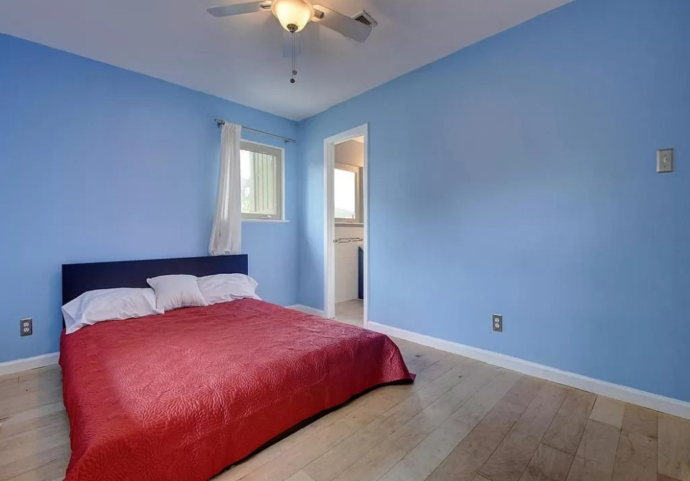 3209 Barton View Drive, Unit A Austin, TX 78735 - Photo 5 of 14 Bedroom featuring hardwood / wood-style flooring and ceiling fan