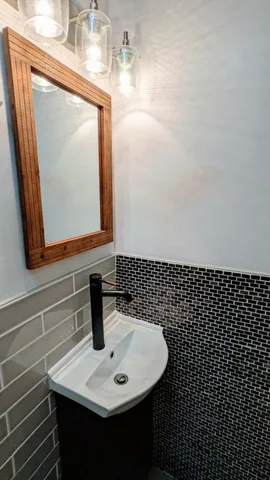 a bathroom with a sink and a mirror