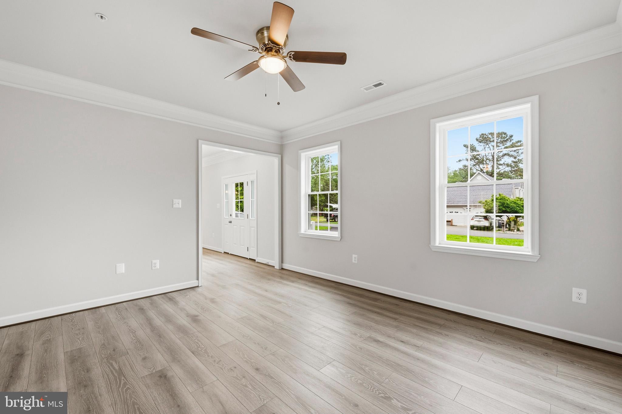 29725 Bruce Road Mechanicsville, MD 20659 - Photo 31 of 79 a view of an empty room with a window and wooden floor