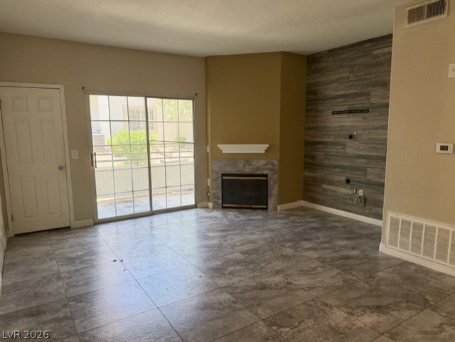 3318 North Decatur Boulevard, Unit 1163 Las Vegas, NV 89130 - Photo 7 of 35 A well-lit living area offers an inviting fireplace and direct outdoor access through sliding doors.