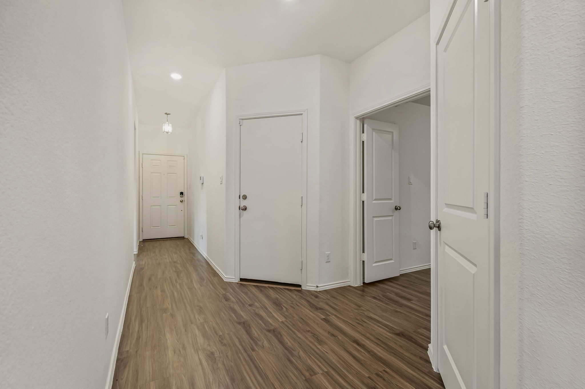 3489 Pauling Loop Round Rock, TX 78665 - Photo 17 of 32 Entryway & a photo of the garage door to enter directly from the home.