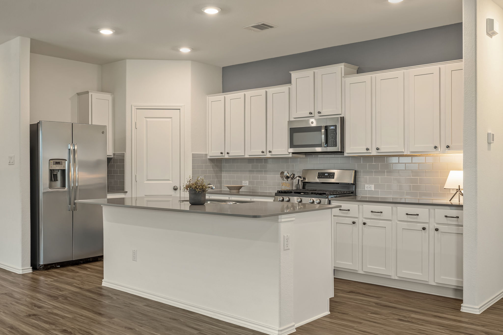 3489 Pauling Loop Round Rock, TX 78665 - Photo 2 of 32 The center island is the heart of the kitchen with room for 4 stools for people to gather around while the chef cooks.