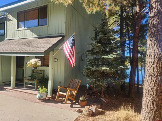 a view of backyard with outdoor seating