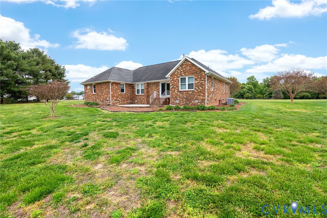 16379 Arch Hill Road Hanover, VA 23069 - Photo 21 of 26 a front view of a house with yard and green space