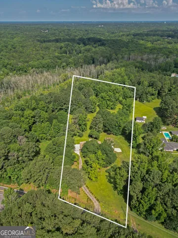 a view of a garden with a building