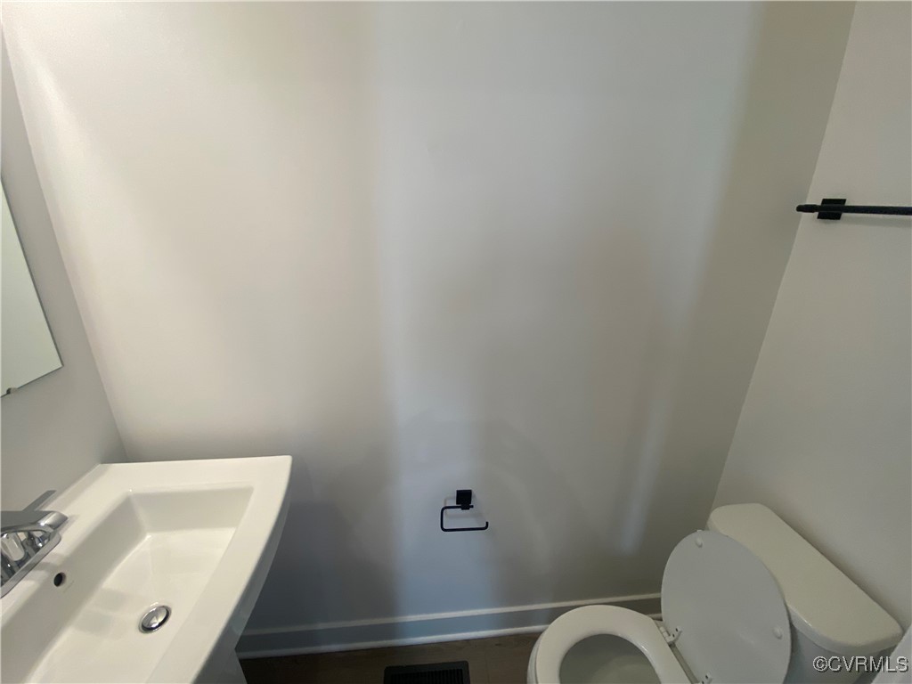 14031 Millpointe Road, Unit 15C Midlothian, VA 23114 - Photo 14 of 17 a bathroom with a sink and a toilet