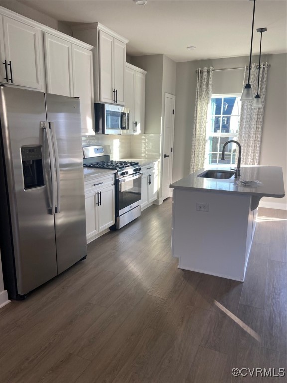 14031 Millpointe Road, Unit 15C Midlothian, VA 23114 - Photo 4 of 17 a large kitchen with stainless steel appliances granite countertop a refrigerator a sink a stove and white cabinets