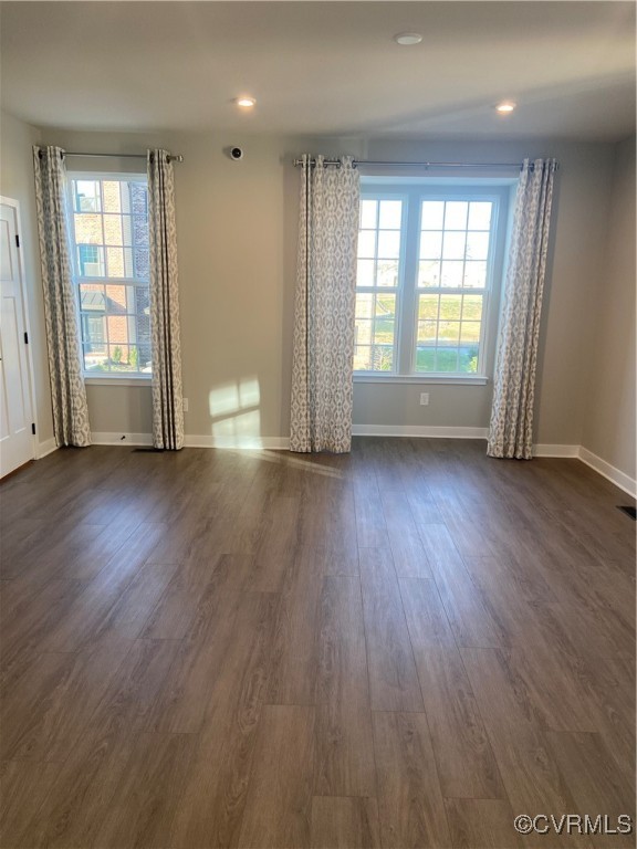 14031 Millpointe Road, Unit 15C Midlothian, VA 23114 - Photo 7 of 17 an empty room with wooden floor and windows
